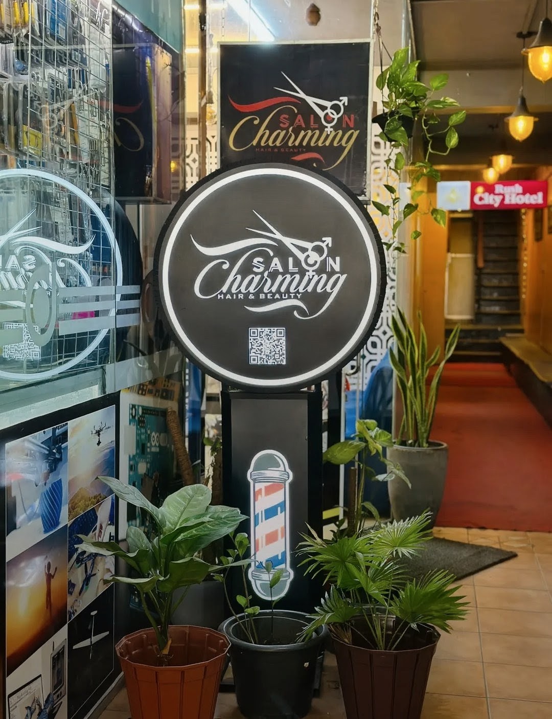 Salon Charming storefront with barber pole and circular sign